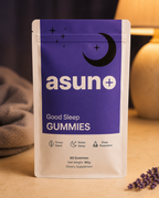 Asuno Good Sleep Gummies pouch on a nightstand with a warm lamp and lavender