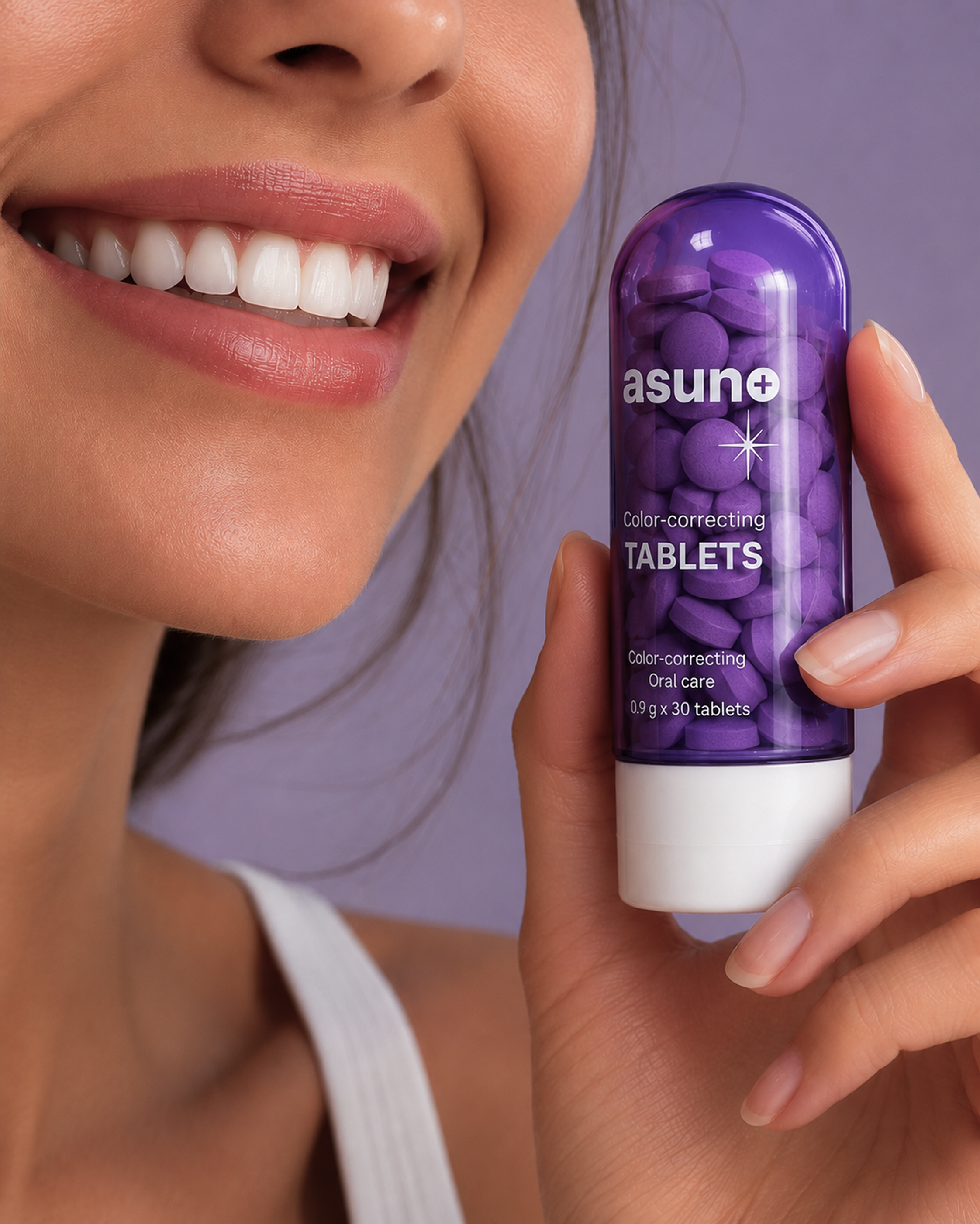 Smiling person holding a bottle of Asuno Color-Correcting Tablets for a brighter smile