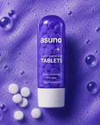 Asuno Color-Correcting Tablets bottle with scattered purple tablets — vegan whitening oral care